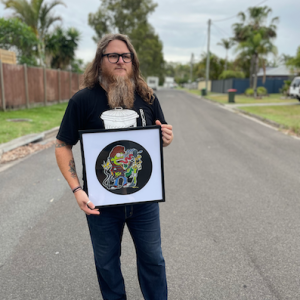 Cartoonist to the stars: Drumming sensation Adam Niven brings art to Solbar