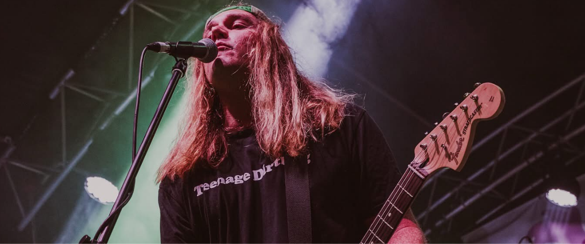 Pricey performing on stage at Blackflag Brewing.