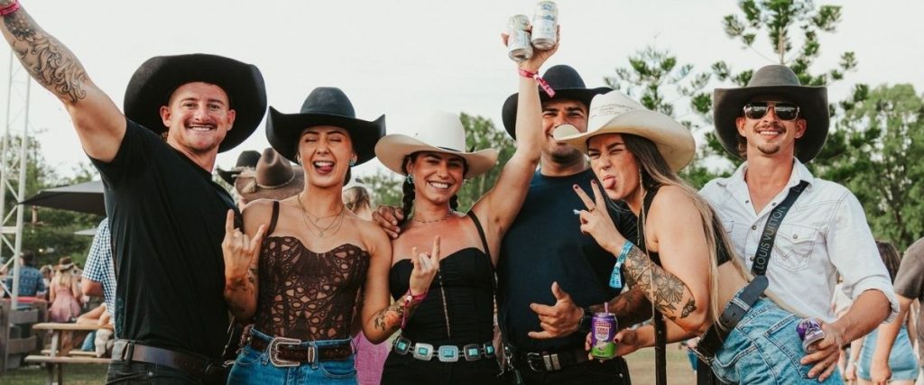 Country music fans in cowboy hats at CMC Rocks QLD