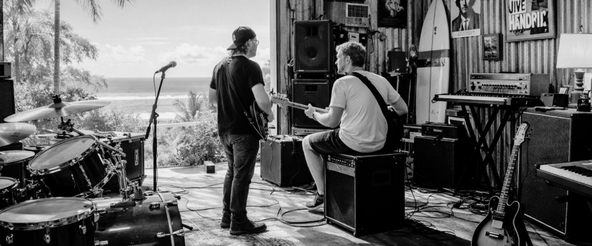 two musicians practicing in a sunshine coast rehearsal space