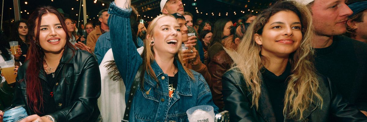 Photo of music fans drinking beer at Festival of the Stone.