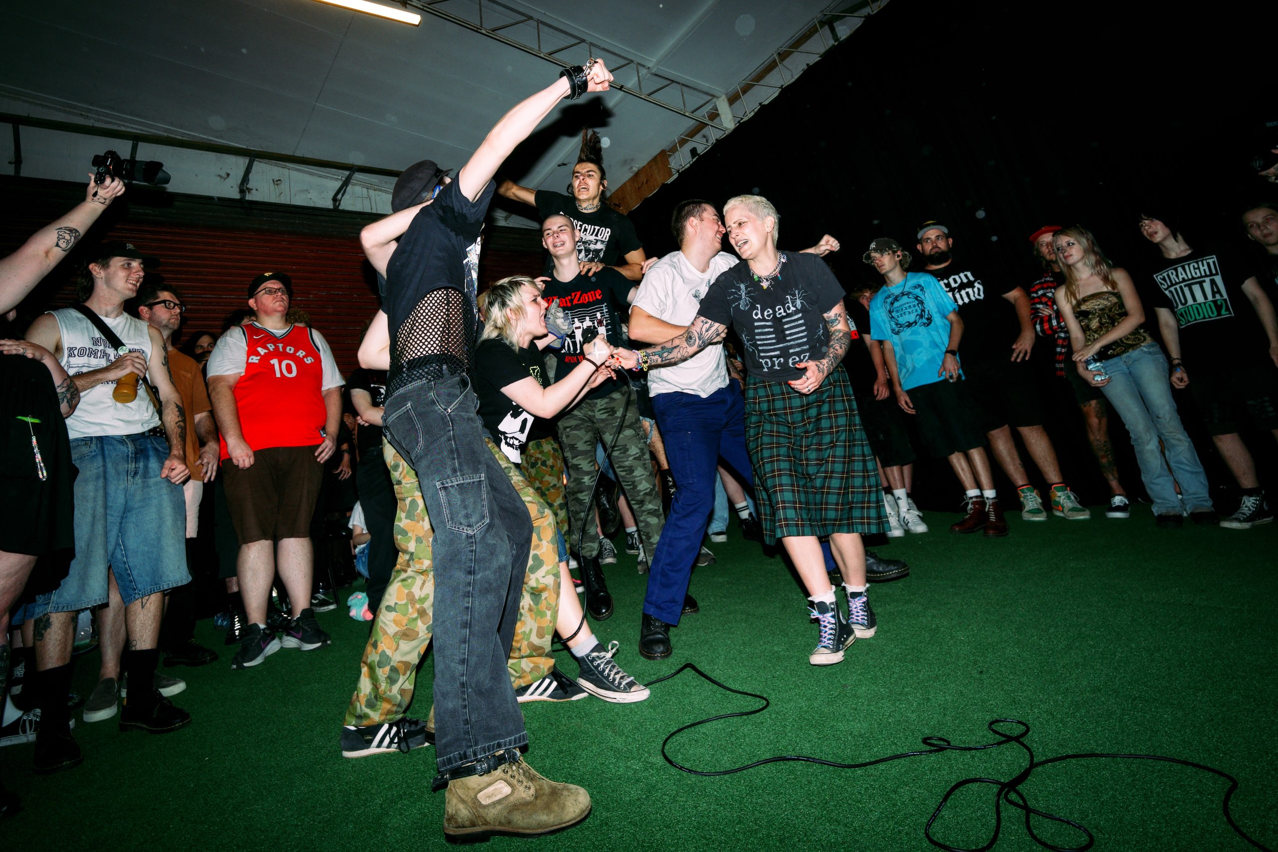 Crowd gathered in the Old Ambo Gallery ramp space during Black Market Day in Nambour.