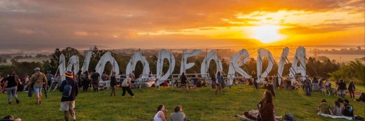 Photo of Woodfordia villagers enjoying a sunrise at Woodford Folk Festival.
