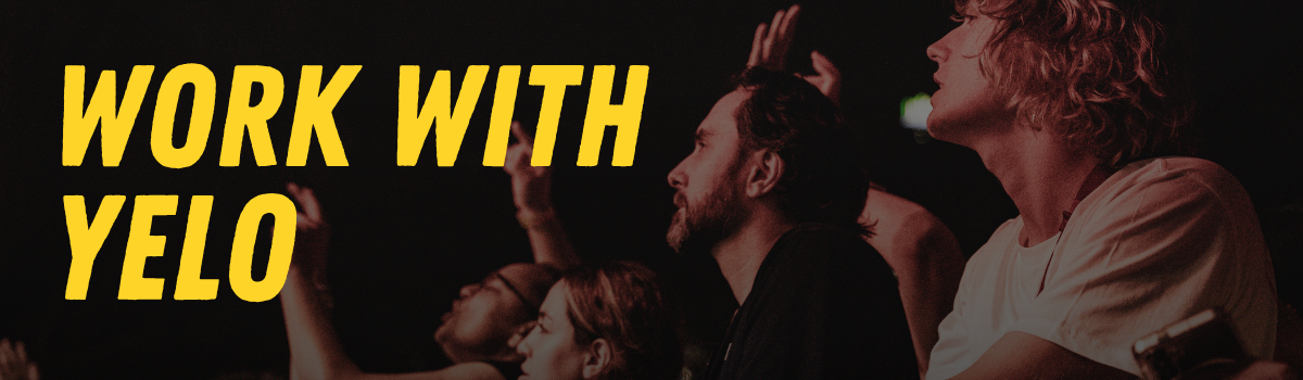 "Work with YELO" banner with yellow text over a retro-style image of people standing in front of a stage and looking up.