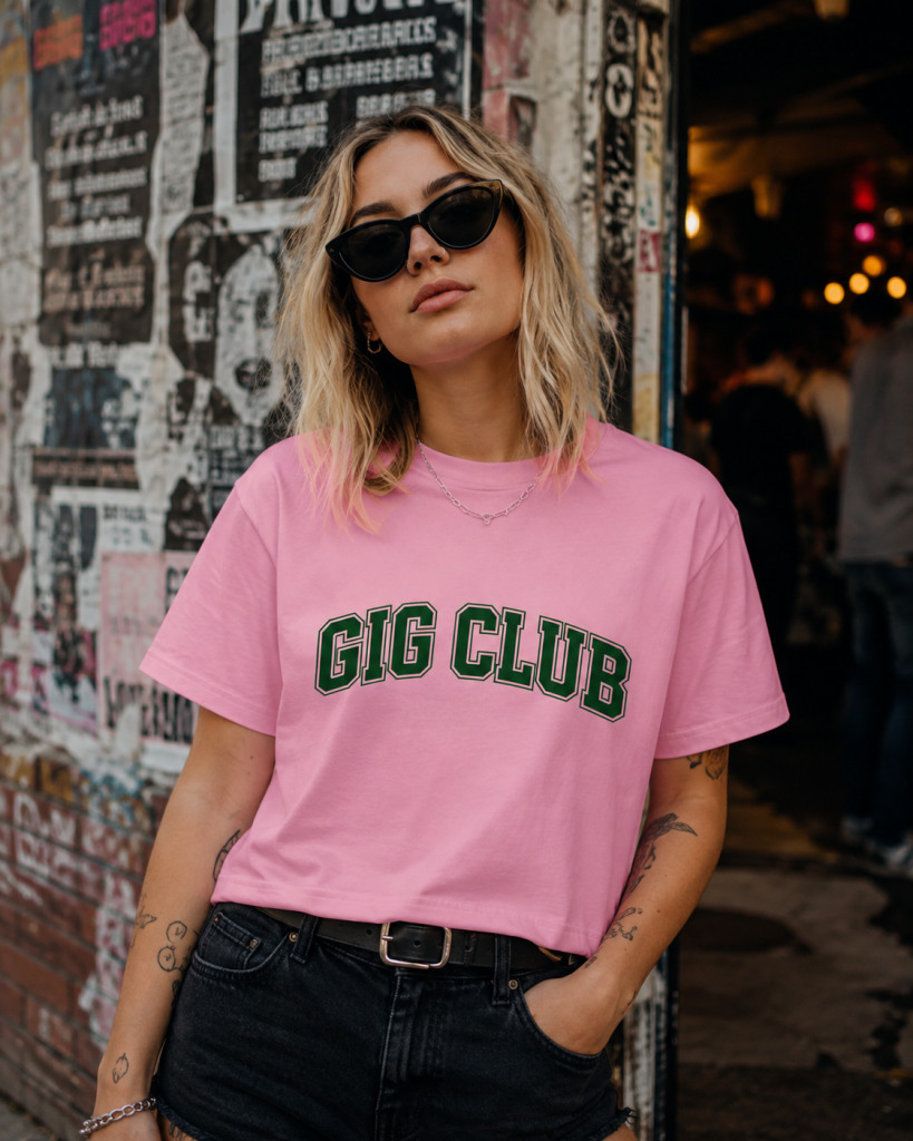 Woman wearing a bubblegum pink GIG CLUB cropped tee for music lovers