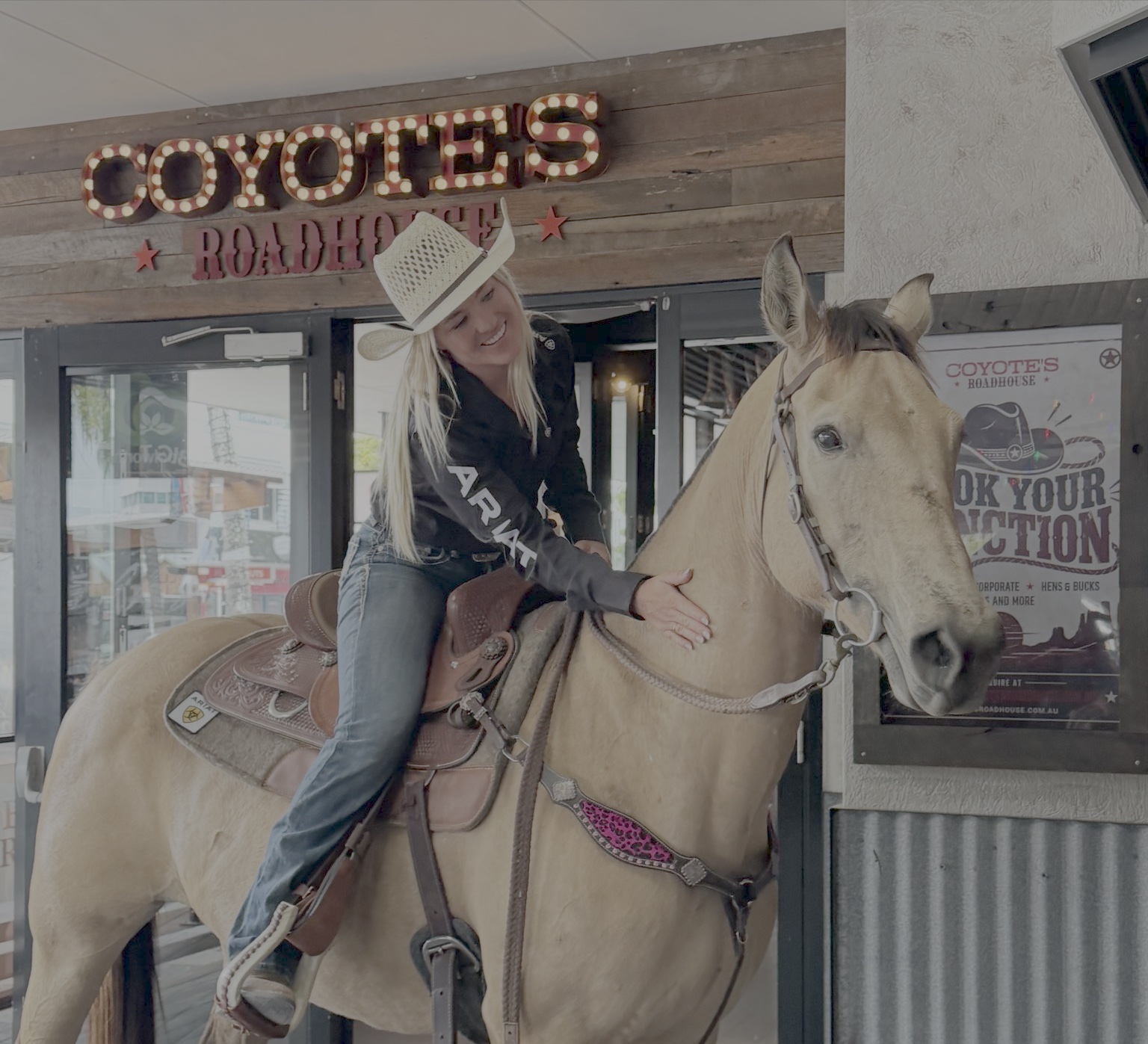 Cowgirl on horseback at the opening of Coyote's Roadhouse in Maroochydore