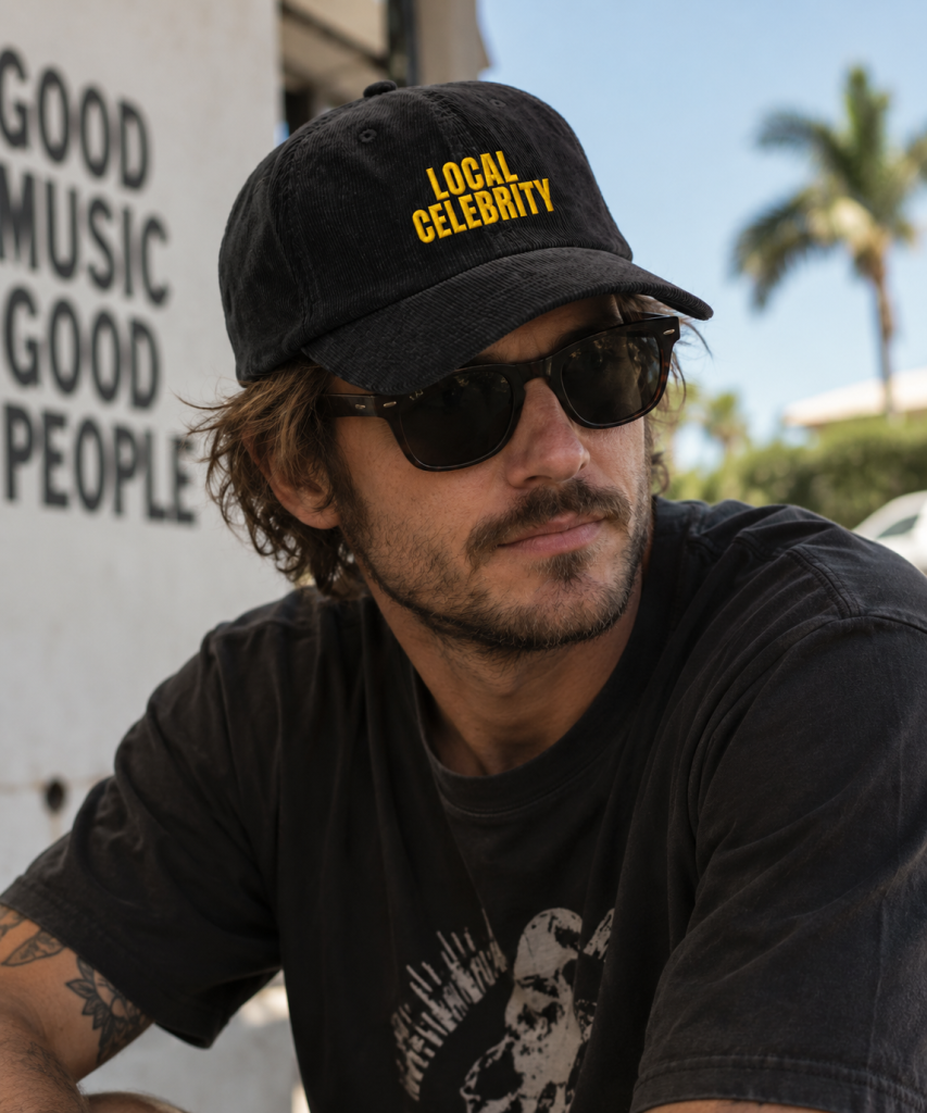 Man wearing a LOCAL CELEBRITY corduroy cap inspired by indie music culture
